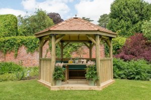 Forest Garden 3.6m Hexagonal Wooden Garden Gazebo with Cedar Roof - Furnished with Table, Benches and Cushions (Green) 