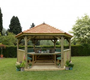 Forest Garden 4.7m Hexagonal Wooden Garden Gazebo with Cedar Roof - Furnished with Table, Benches and Cushions (Green)