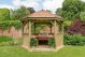 Forest Garden 3.6m Hexagonal Wooden Garden Gazebo with Cedar Roof - Furnished with Table, Benches and Cushions (Terracotta)