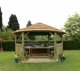 Forest Garden 4.7m Hexagonal Wooden Garden Gazebo with Thatched Roof - Furnished with Table, Benches and Cushions (Green)