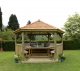 Forest Garden 4.7m Hexagonal Wooden Garden Gazebo with Cedar Roof - Furnished with Table, Benches and Cushions (Cream)