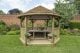 Forest Garden 4m Hexagonal Wooden Garden Gazebo with Thatched Roof - Furnished with Table, Benches and Cushions (Cream)
